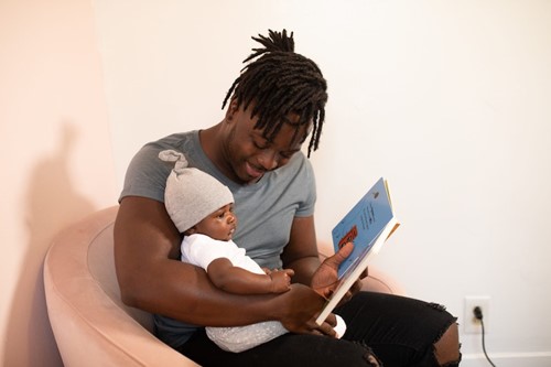 Man reading to baby