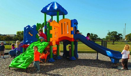 Children playing on colourful playground slide