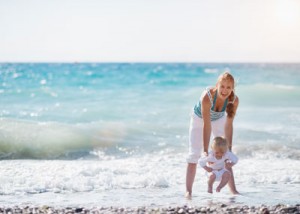 Family holiday on beach with toddler