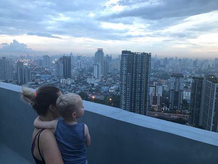 Jasper and I admiring the Bankok skyline from the rooftop of my brother's apartment on On Nut